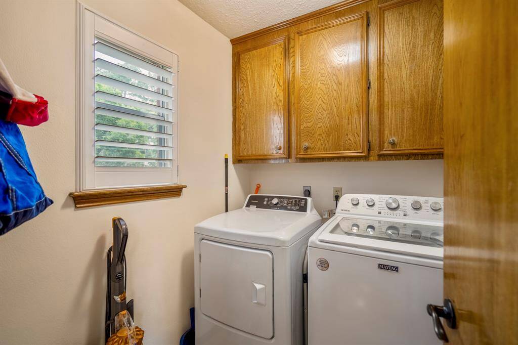 In-house Laundry Room with storage/cabinetry