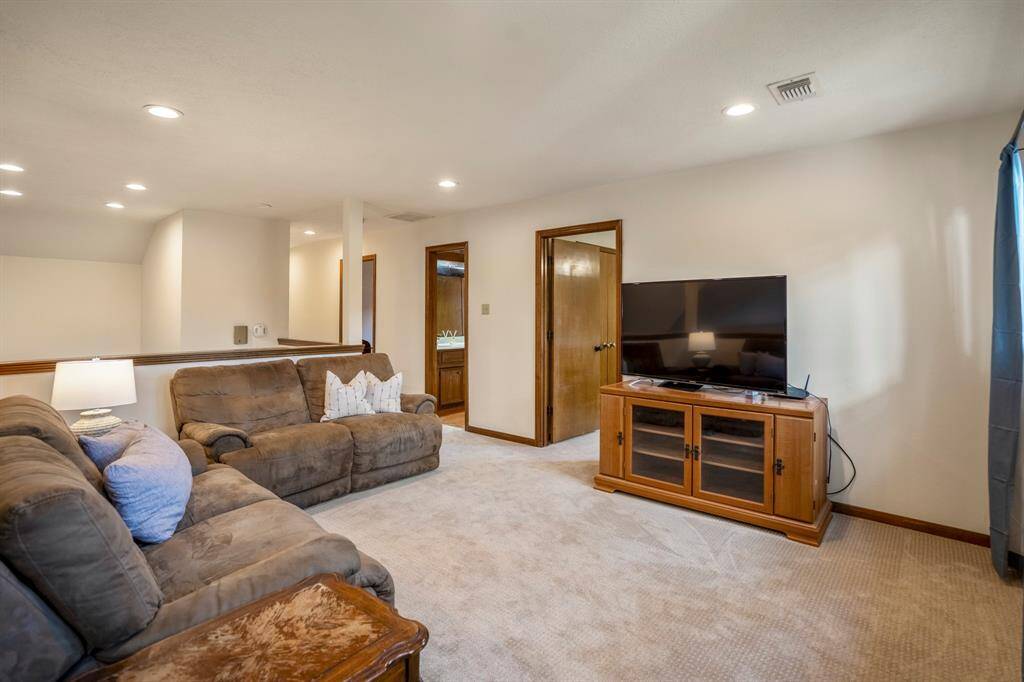 Gameroom at the top of the stairs is carpeted with brand new carpet.