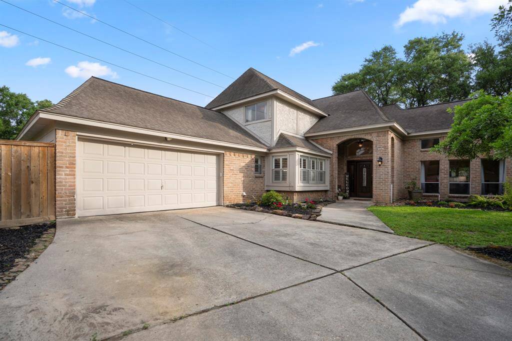 Large, double-wide driveway leading to a two-car Garage.