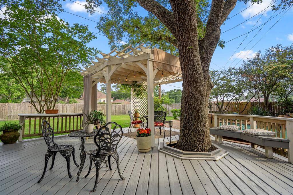 Mature trees provide tons of shade in the afternoons on this deck.