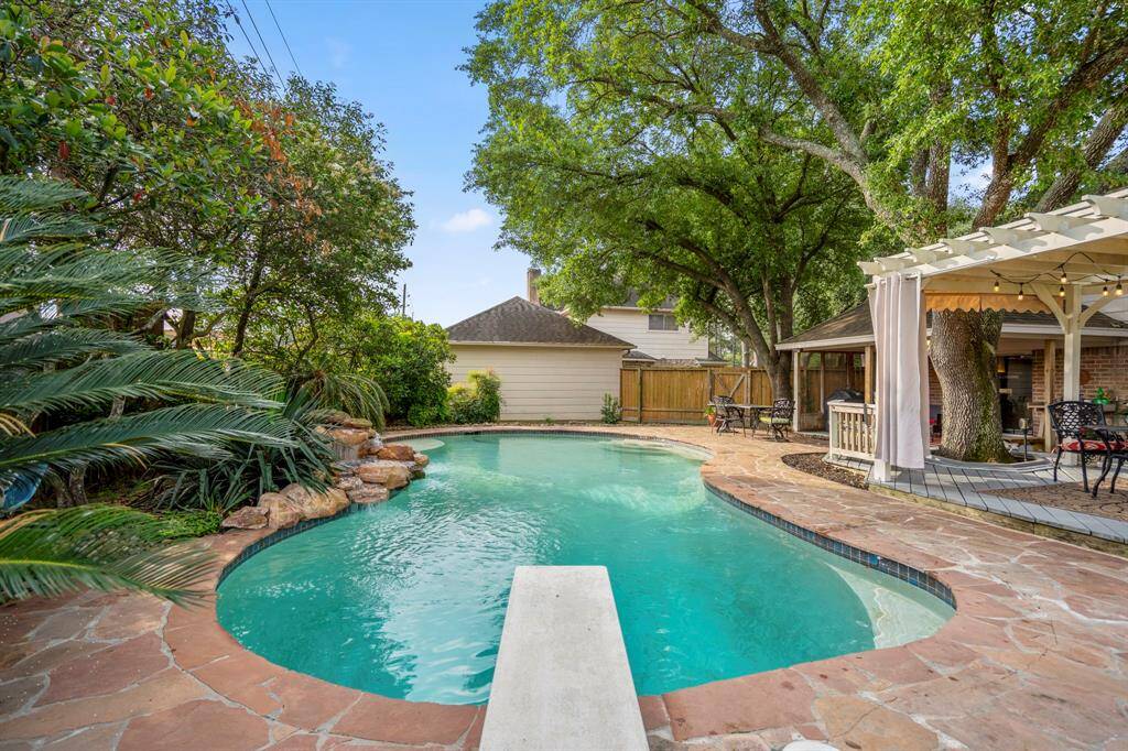 Pool features a diving board