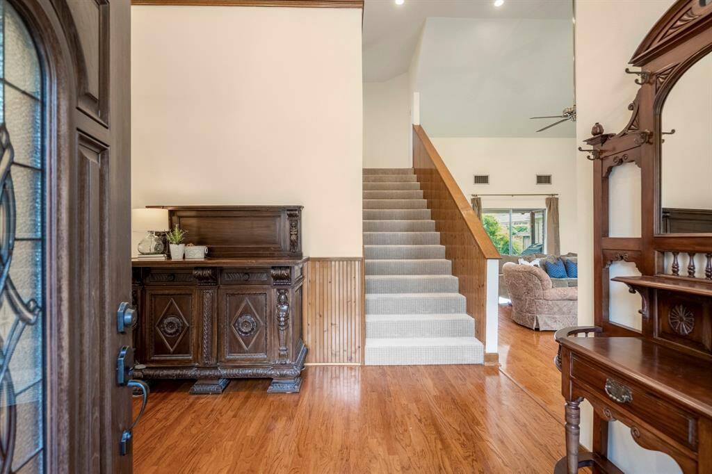 Upon entering the home, you walk into a gorgeous entry with soaring ceiling.