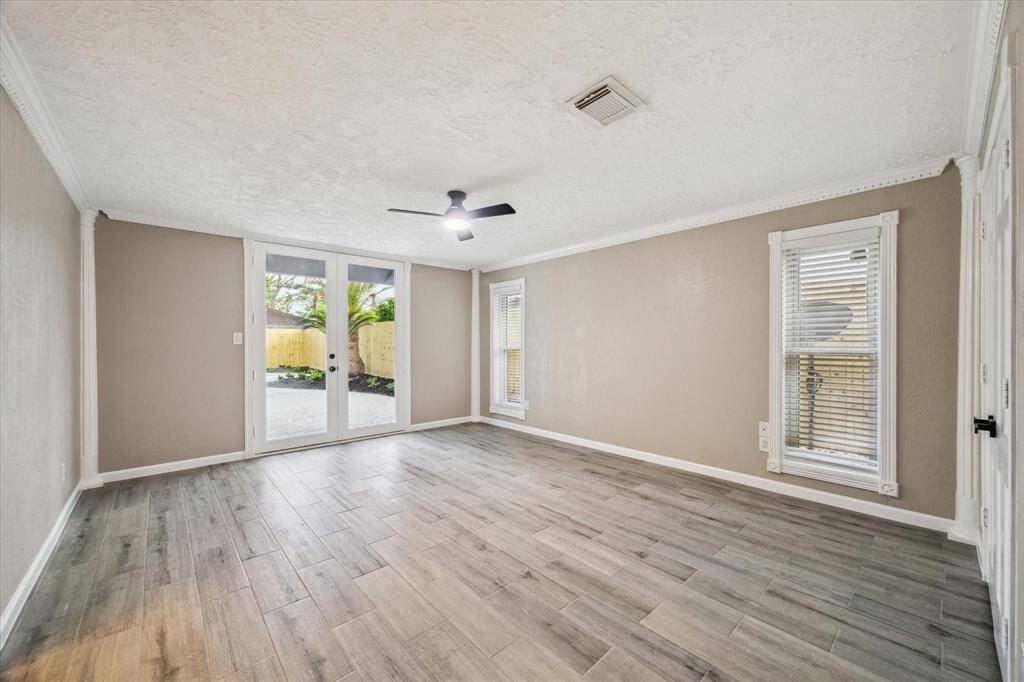 PRIMARY BEDROOM WITH ENTRANCE TO YOUR OUTDOOR OASIS