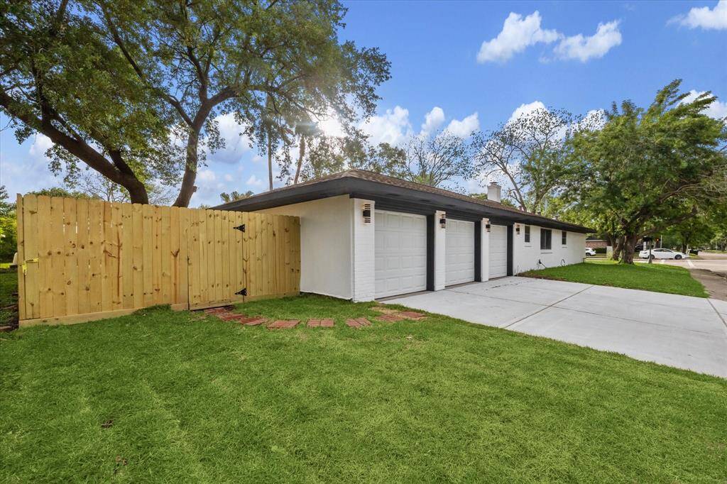 RECENTLY ADDED FENCE AND VIEW OF SIDE YARD