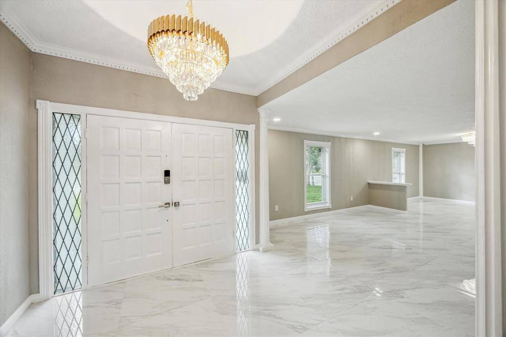 BEAUTIFUL FRONT DOOR WITH INVITING CHANDELAIR