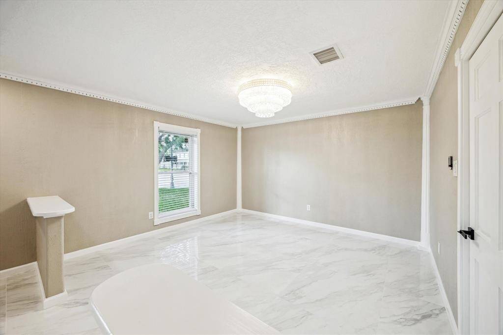 FORMAL DINING ROOM WITH ENTRANCE TO THE KITCHEN