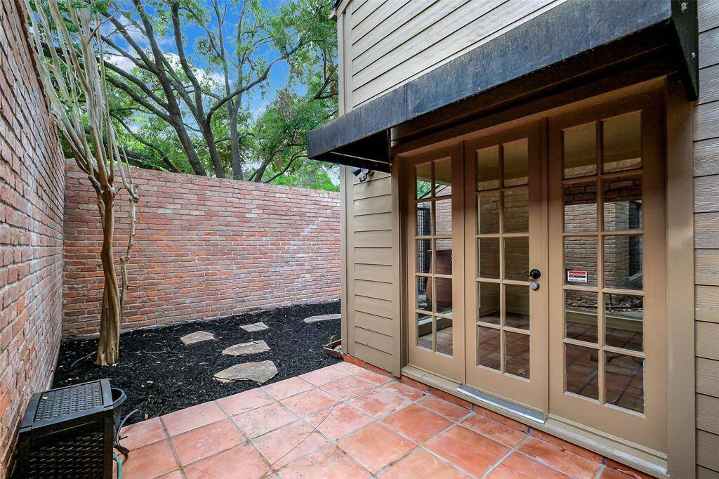 This quaint patio is just outside of your kitchen dining area.