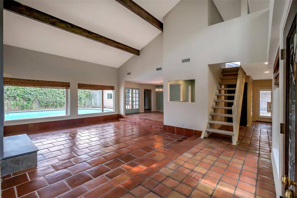 Spacious entry in to the living area with views of the sparkling pool.