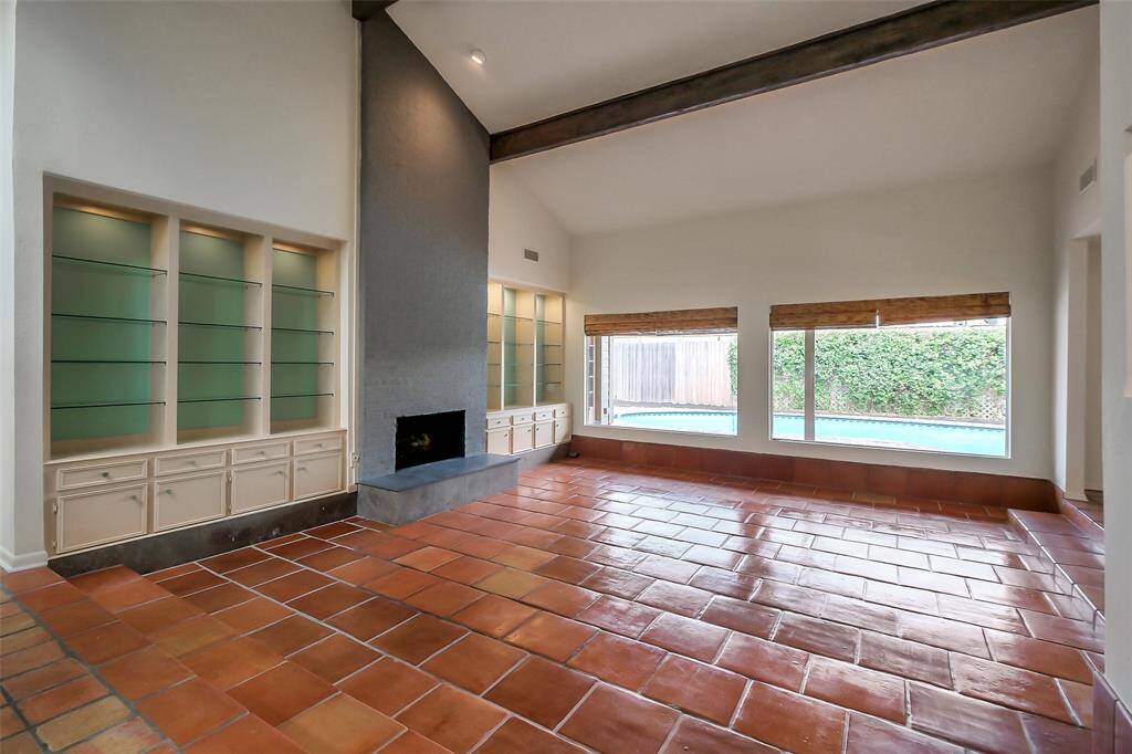 Spacious entry in to the living area with views of the sparkling pool.