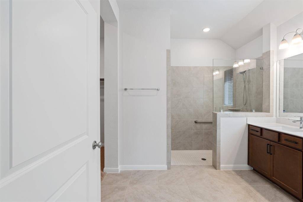Following the flow of the home from the front off of the main entryway is secondary bedroom #1.