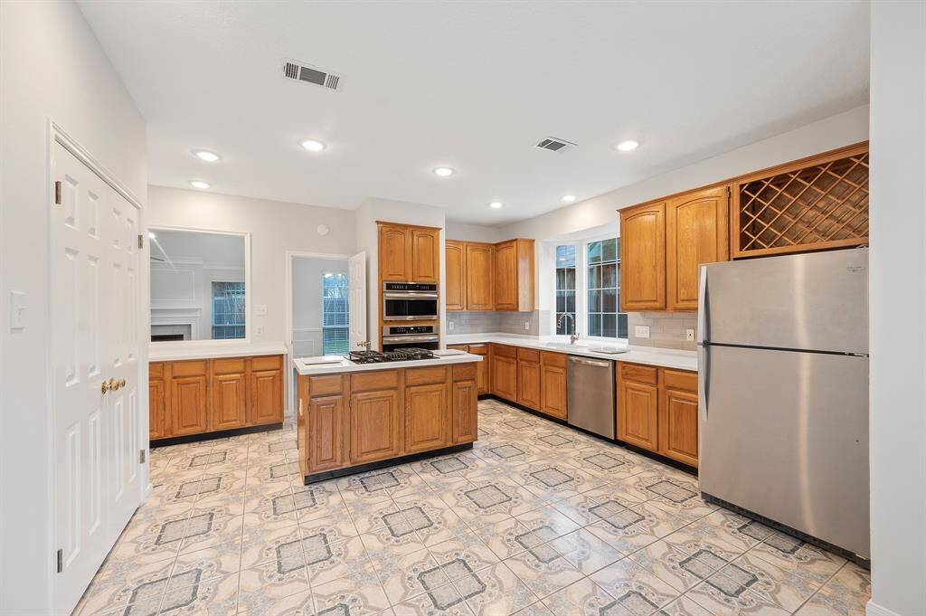 The gourmet kitchen equipped with Stainless Steel Appliances.