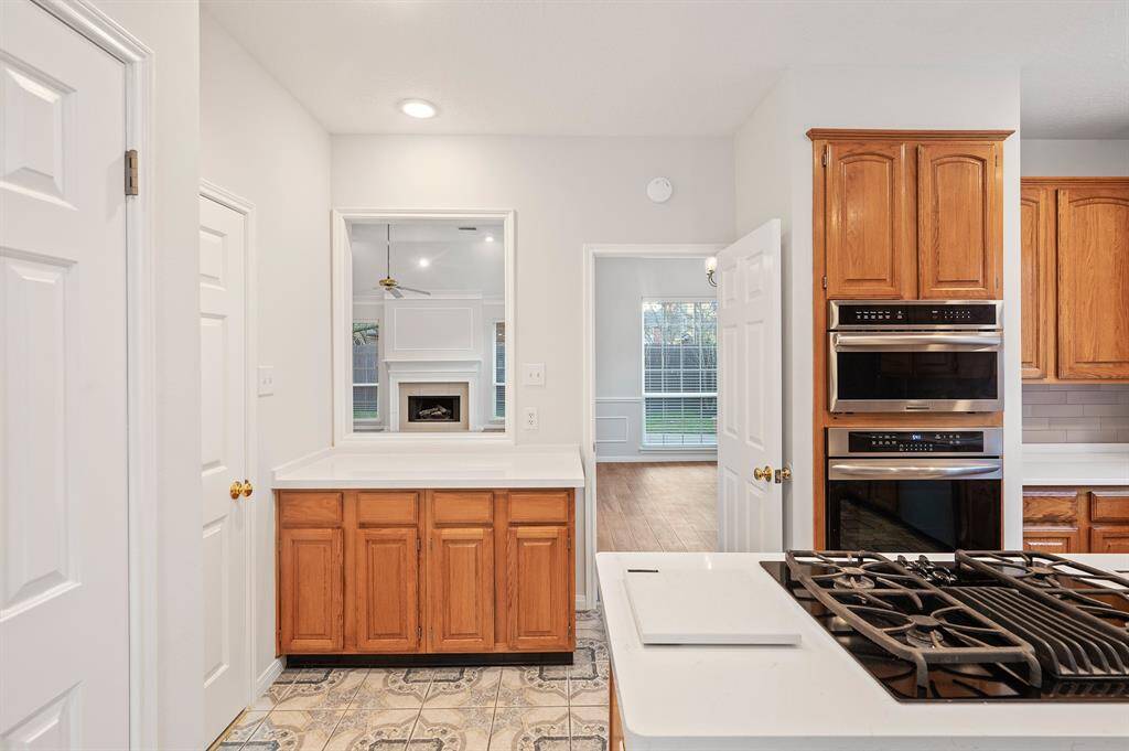 Looking back to the living room and formal dinning from the kitchen.