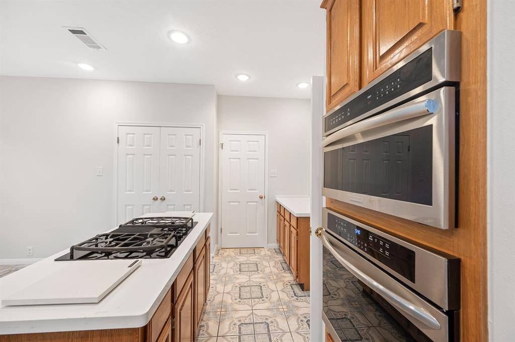 Island with gas cook top and new stainless steel appliances