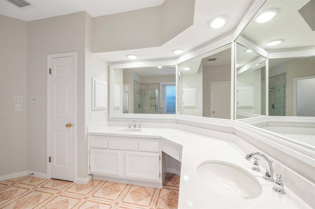 Dual sinks with vanity area and lots of storage