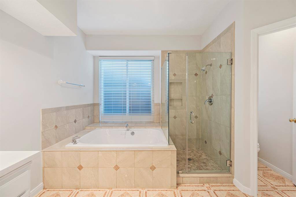 Soak your cares away in this separate tub