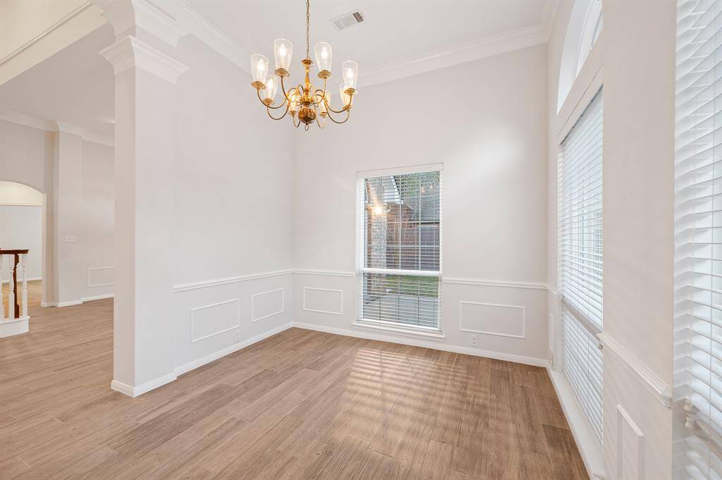 Chair rails, baseboards, crown molding, and specialty lighting create intimate evenings with friends and family.