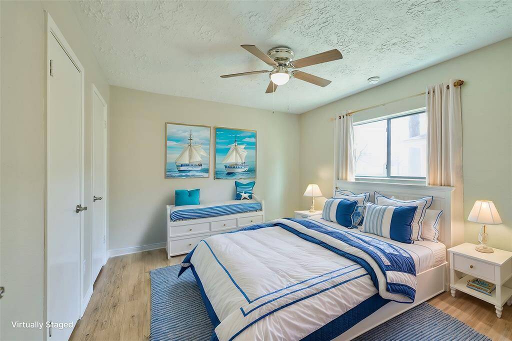Secondary Bedroom. New Ceiling Fan, Windows, Fixtures, Flooring and Paints