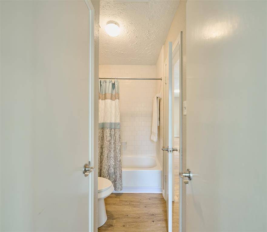 A sneak peek at the Hall Bath Tub & Shower, Toilet, and Linen Closet.