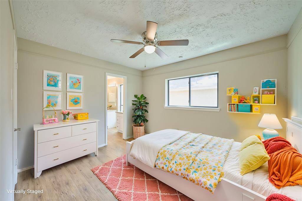 The Third Bedroom includes a new Ceiling Fan, Window, VPF Flooring, and Walk-In Closet.  The rooms have been virtually staged.