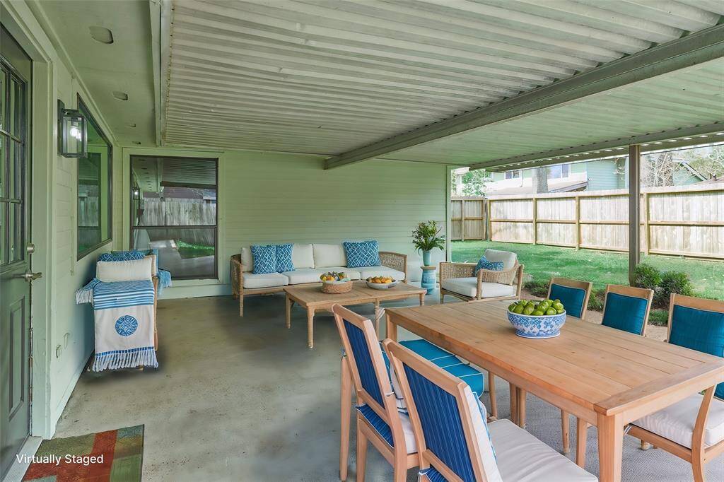 Covered Patio protects from the hot summer sun!  Great for Entertainment or simply Relaxing and enjoying Nature and the Tranquil Backyard!