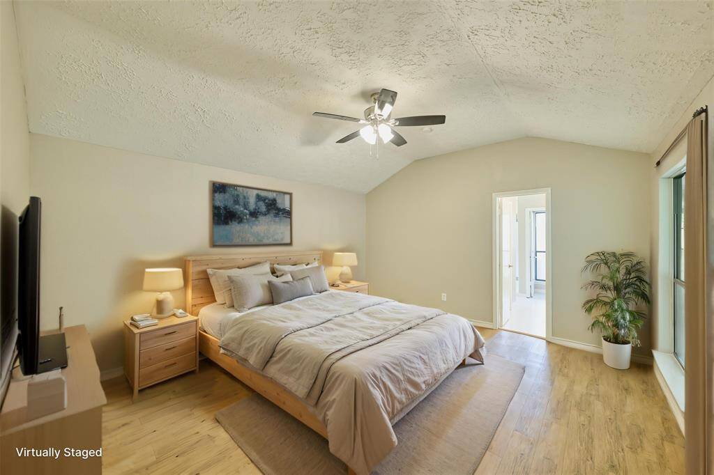 Primary Suite with new Ceiling Fan, Windows, Flooring and Fixtures.