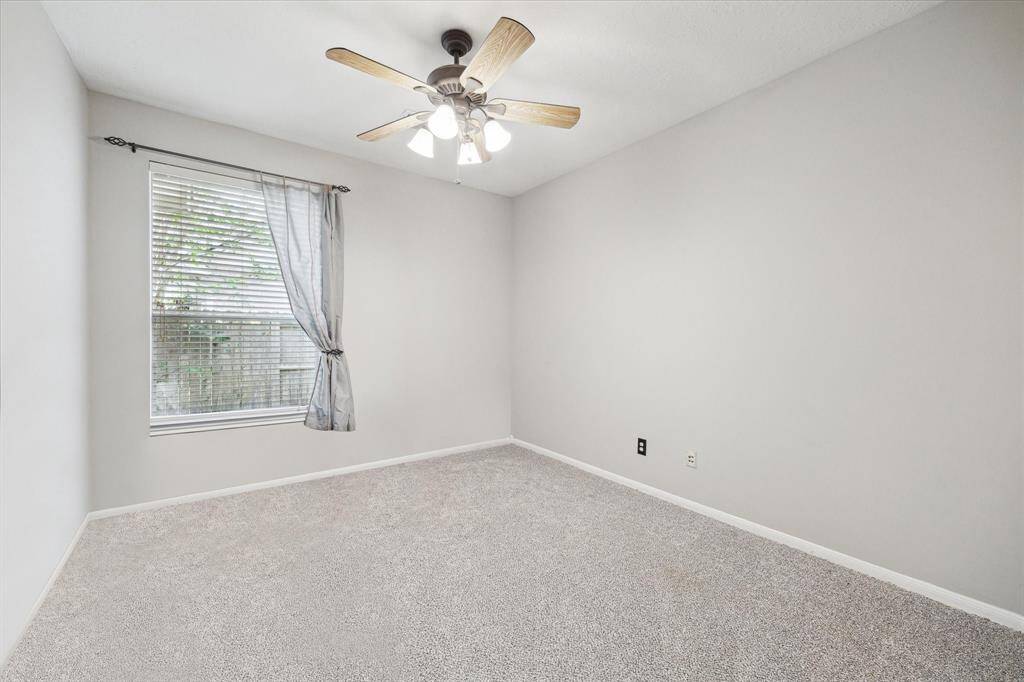 Downstairs bedroom, features new carpet and fresh paint.
