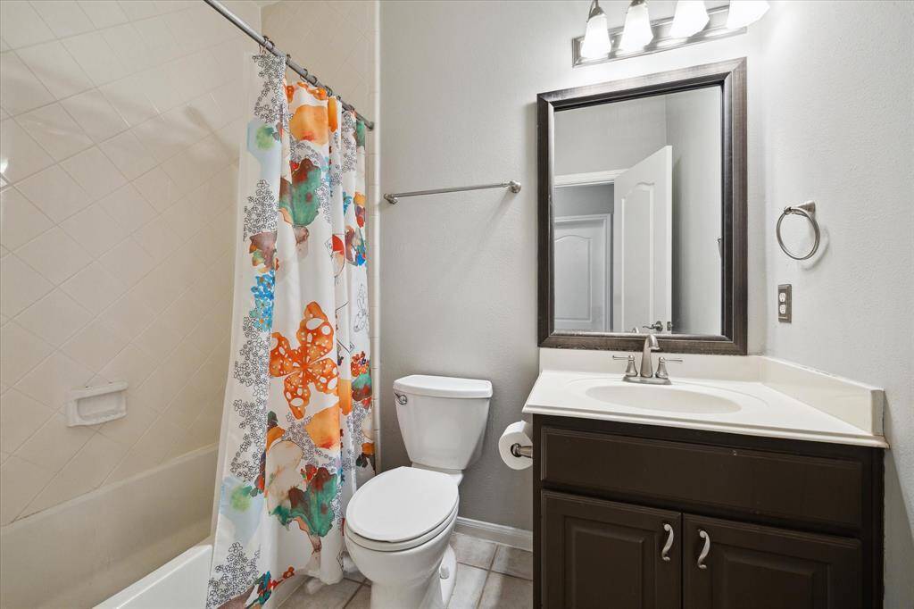 Conveniently located full bath adjacent to the downstairs bedroom.