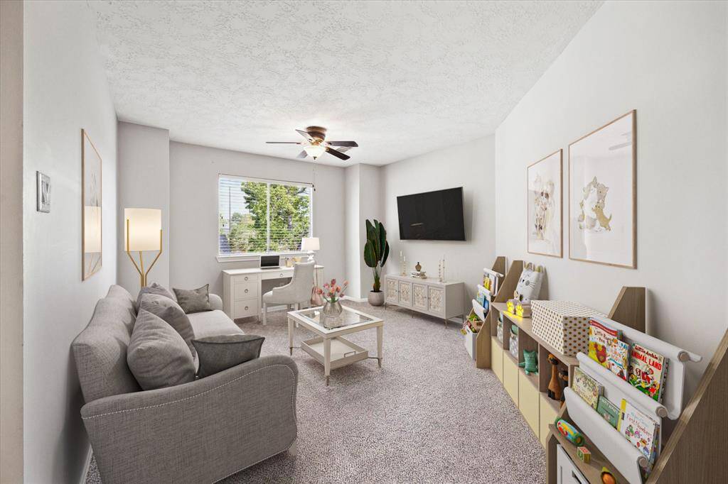 Upstairs discover a spacious game room, perfect for relaxation and entertainment.- Virtually staged