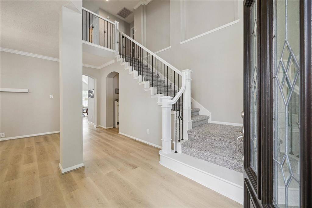 Enter into a home freshly redone in neutral tones and updates throughout