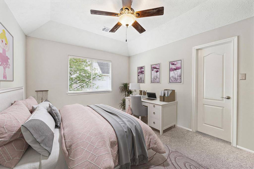 The second of the inviting secondary bedrooms upstairs, virtually staged for a cozy and functional living space.