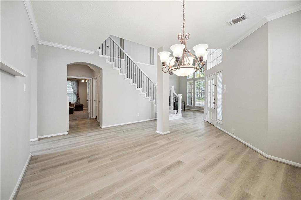 A spacious formal dining room welcomes you just off the entryway.