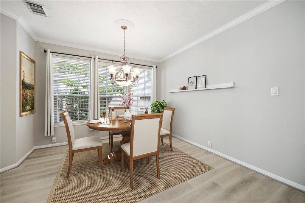 Elegant formal dining room, beautifully virtually staged to inspire memorable gatherings.