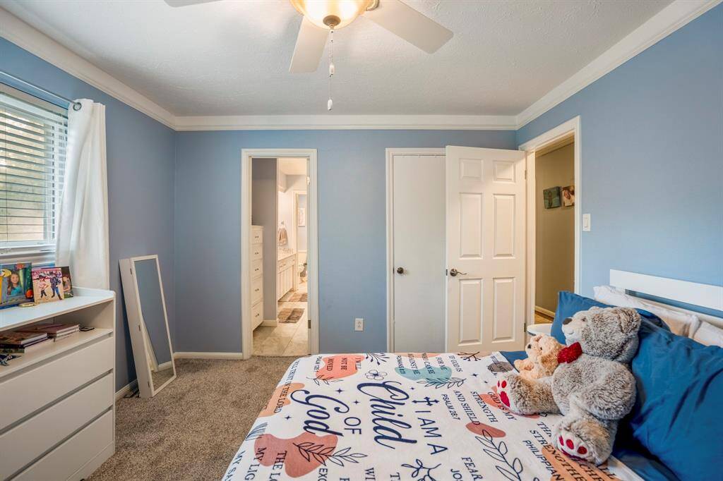 This room has an attached bath and a walk in closet.