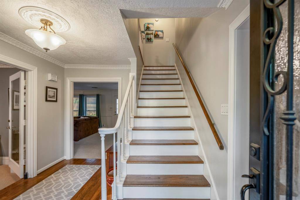 The wood flooring continues up the stairs to the second floor.
