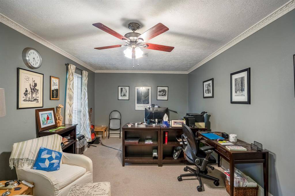 This was likely the formal living area previously, but now is a large study.
