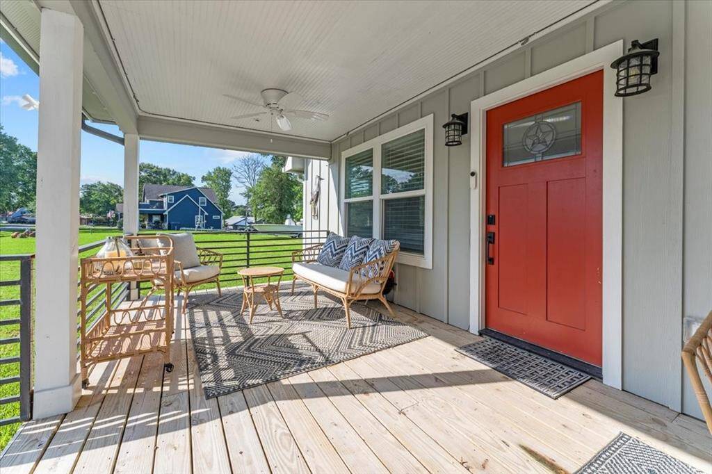 Welcome to 1345 Indian Hill Blvd! Relax and unwind on this inviting porch, perfect for weekend enjoyment and waves of Lake Livingston!