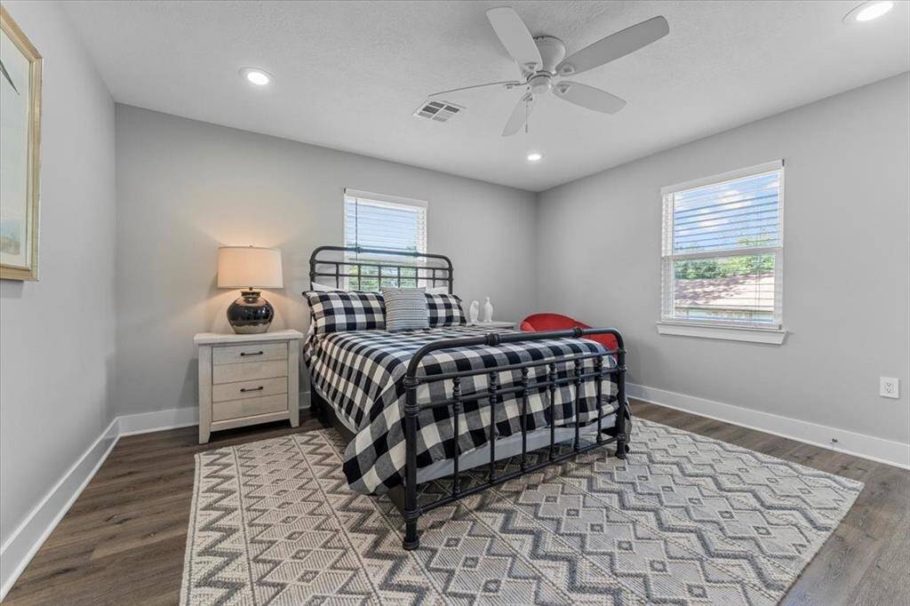 This is the third of the bedrooms, it's tucked away in the back of the home. It has a lot of natural light and room for all your necessities.