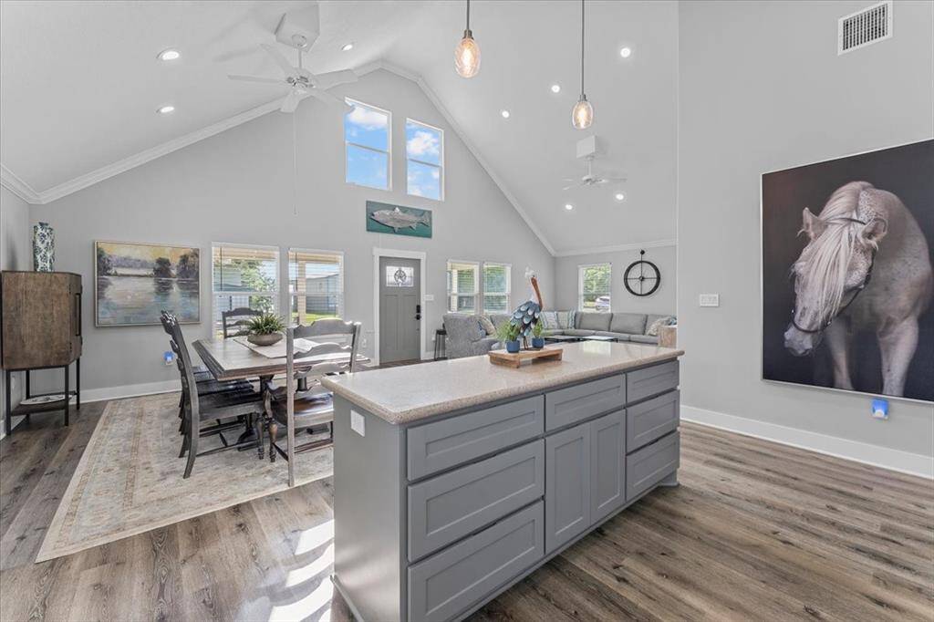 The kitchen island features so much storage and an inviting area to serve guest!