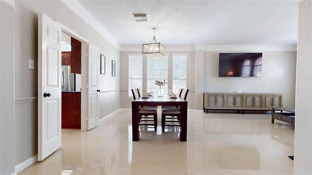 Dining Area which opens to the Formal Living Area and easy passage to and from the kitchen.