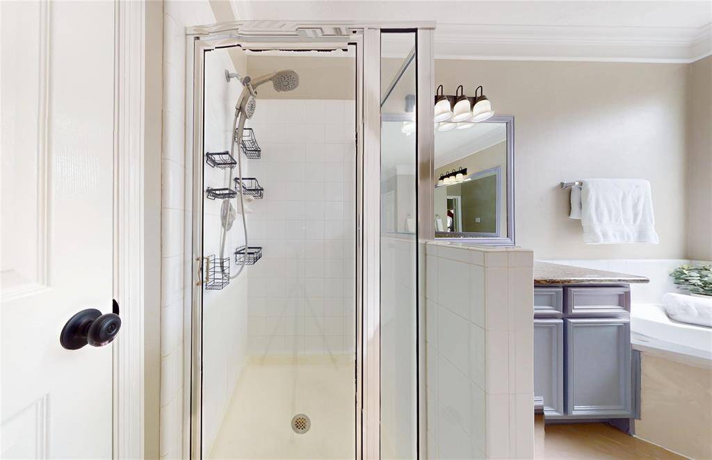 The Primary Bathroom also features a stand alone shower.