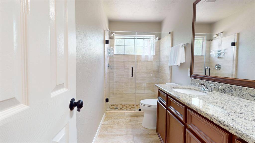 Guest Bathroom #2 with a glass shower.