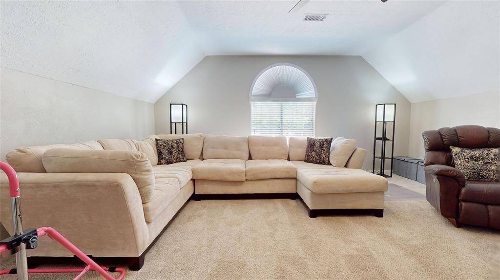 This inviting Game Room has plenty of space, ideal for relaxation and entertaining.