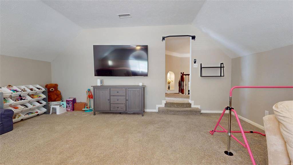 Another view of the spacious game room that is located on the second floor.