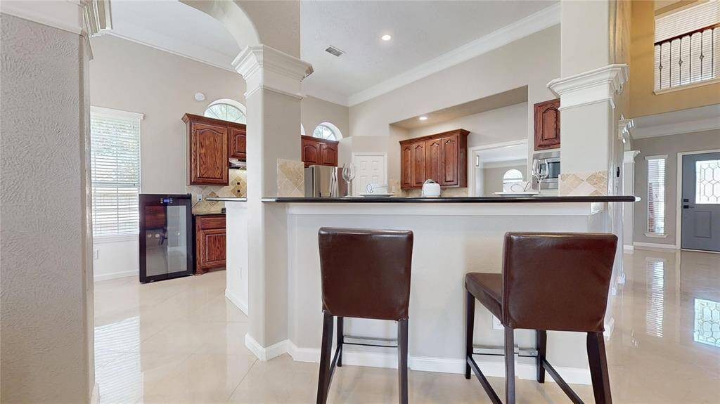 The kitchen opens up the the breakfast area, breakfast bar and living area.