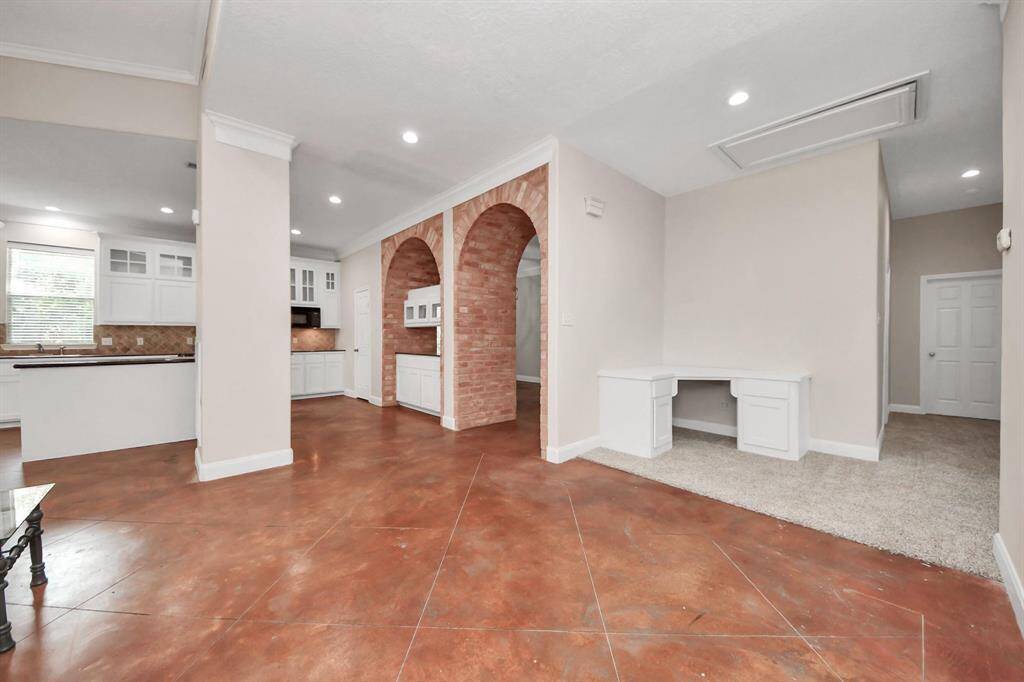 The open flow of the layout connects seamlessly to the rest of the living spaces, all while maintaining defined rooms that offer purpose and character.