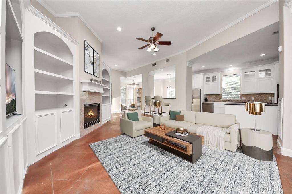 The home opens up into a stunning open-concept living and dining area, thoughtfully designed to bring people together while still maintaining a sense of warmth and comfort.