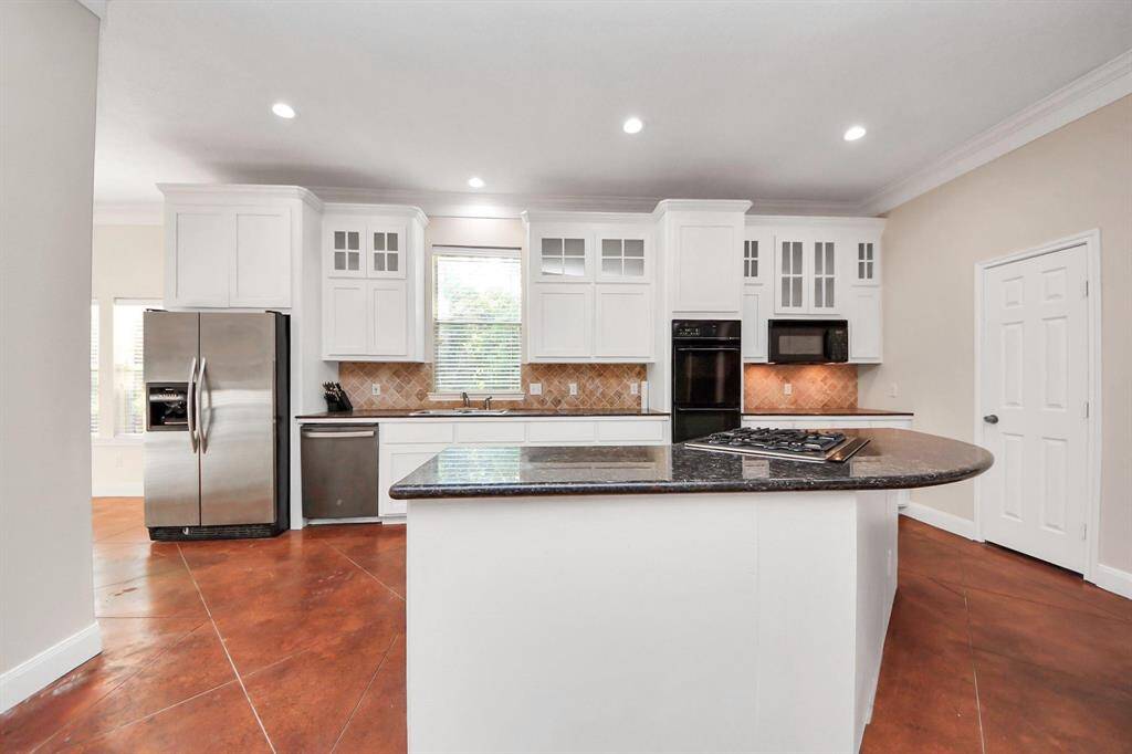 The kitchen is a true centerpiece of the home—both beautiful and highly functional.