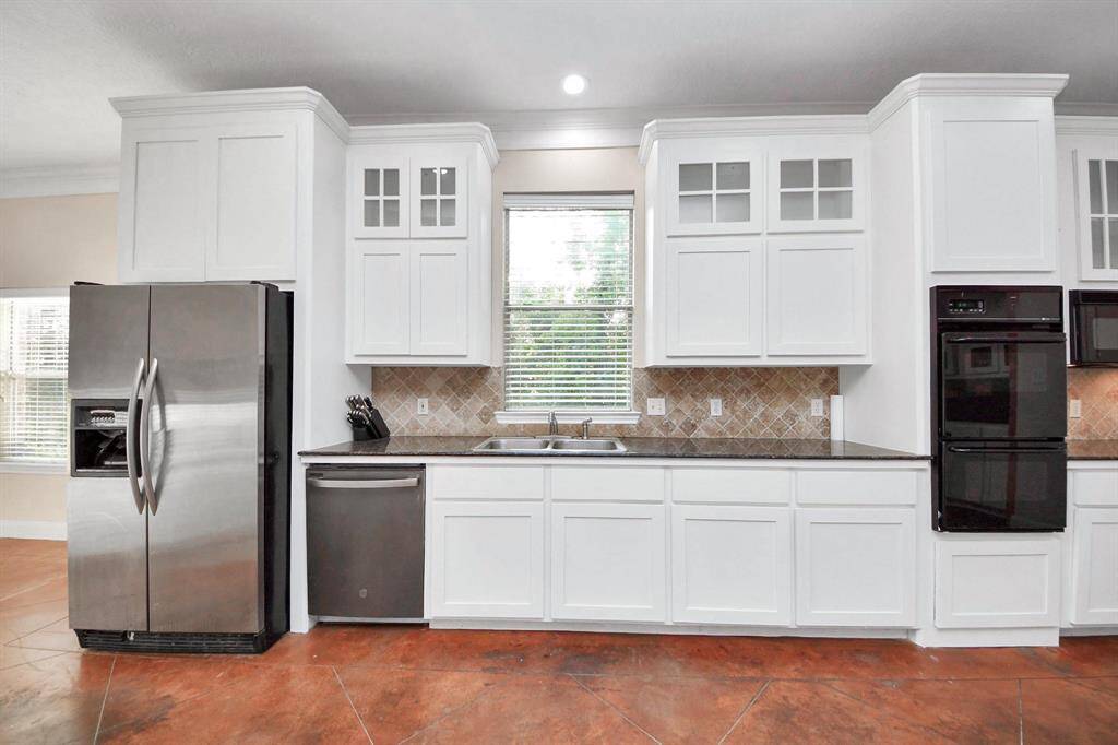 Outfitted with sleek stainless steel appliances, this kitchen is ready for everything from quiet weekday dinners to holiday hosting.