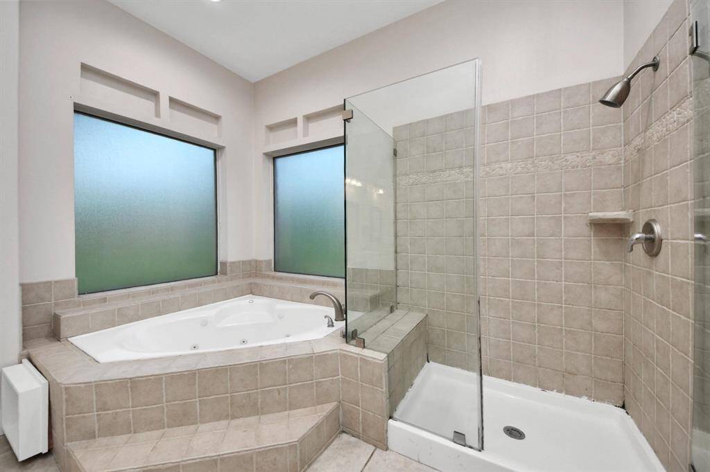 Completing the suite is a generous walk-in closet, offering plenty of space to keep everything organized and easily accessible.