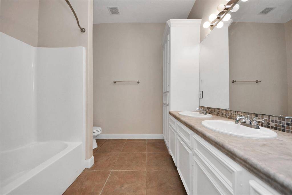 All secondary bedrooms are conveniently situated and share access to a well-appointed full bathroom with a tub/shower combo, designed with tasteful finishes and plenty of space for shared use.